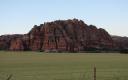 Fence, Field, And Cliff Face